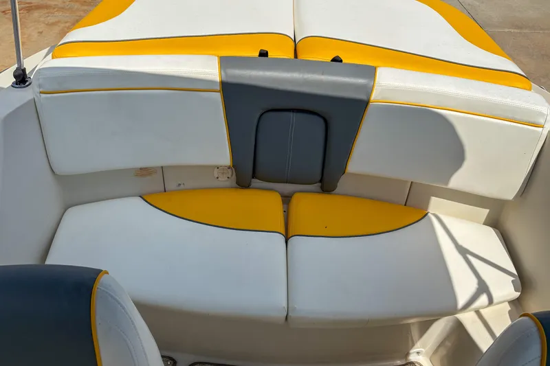 Slide: The Image of 2007 Sea Ray 195 Sport boat interior with yellow and white seating. - 12