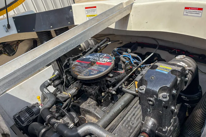 Slide: The Image of Engine compartment of a 2007 Sea Ray 195 Sport boat, featuring a Mercury 5.0 engine. - 13