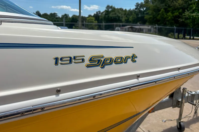 Slide: The Image of 2007 Sea Ray 195 Sport boat with yellow hull and sleek design. - 4