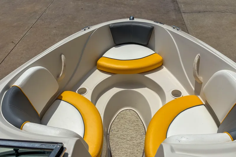 Slide: The Image of 2007 Sea Ray 195 Sport boat interior with yellow and white seating. - 7