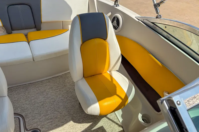Slide: The Image of 2007 Sea Ray 195 Sport boat interior with yellow and gray seating. - 8