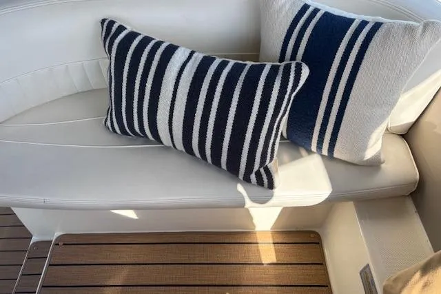 Slide: The Image of Striped cushions on white seating in 2004 Cruisers Yachts 370 Express. - 18