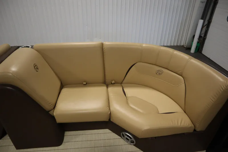 Slide: The Image of 2018 Lowe 230 Retreat WT boat interior with tan leather seating. - 11
