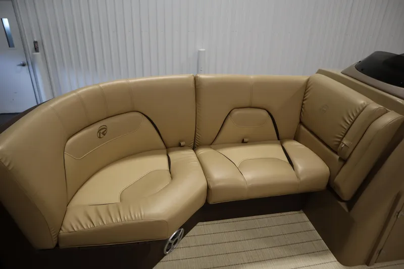 Slide: The Image of 2018 Lowe 230 Retreat WT boat interior with tan leather seating. - 14