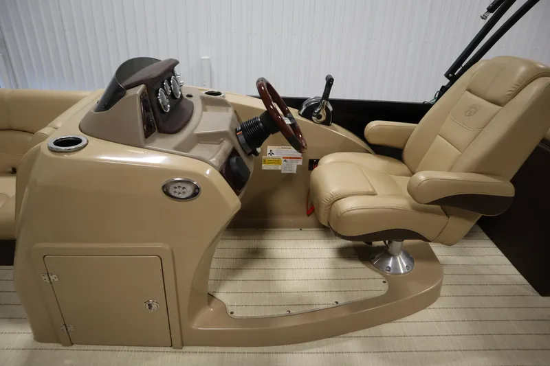 Slide: The Image of 2018 Lowe 230 Retreat WT boat interior with beige captain's chair and control console. - 16