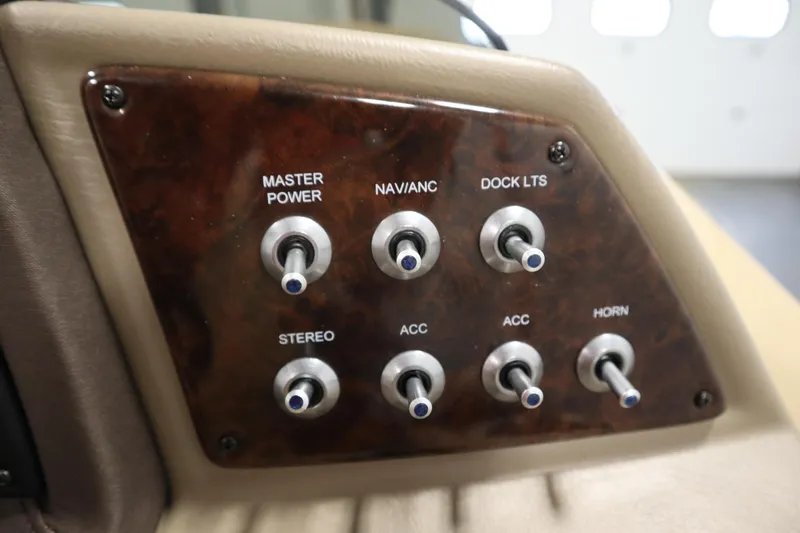 Slide: The Image of Control panel of 2018 Lowe 230 Retreat WT boat with switches for power and accessories. - 21