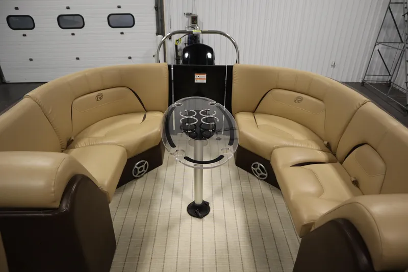 Slide: The Image of Luxurious interior of 2018 Lowe 230 Retreat WT pontoon boat with beige seating and table. - 30