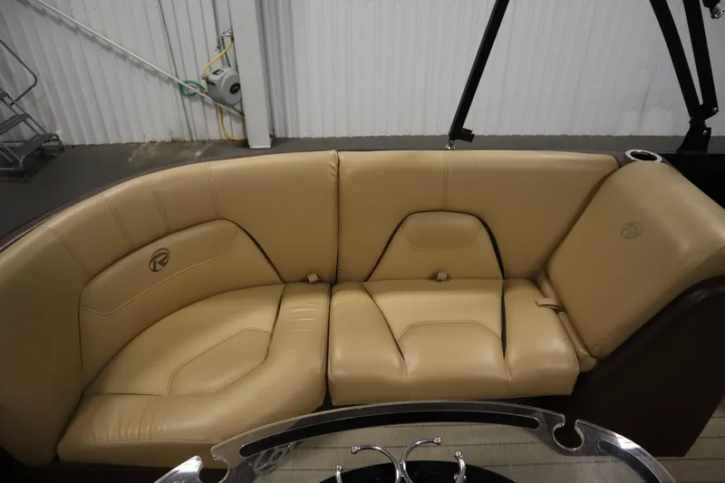 Slide: The Image of Luxurious tan seating on 2018 Lowe 230 Retreat WT boat, featuring sleek design and comfort. - 31