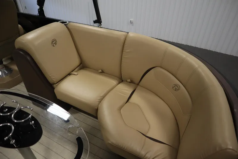 Slide: The Image of Luxurious tan seating in 2018 Lowe 230 Retreat WT boat interior. - 34