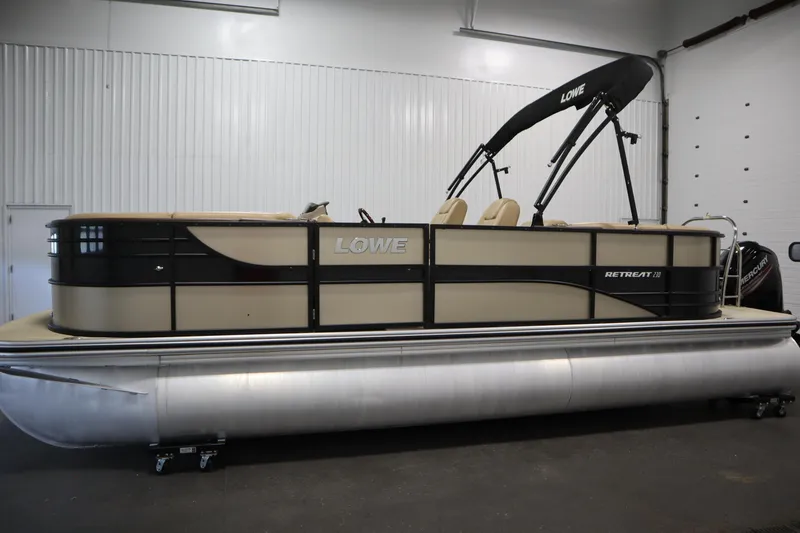 Slide: The Image of 2018 Lowe 230 Retreat WT pontoon boat in indoor showroom. - 7