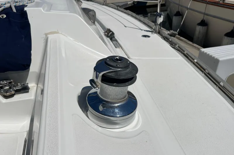 Slide: The Image of Deck of 1988 Hunter 37.5 sailboat featuring a winch and rigging details. - 12