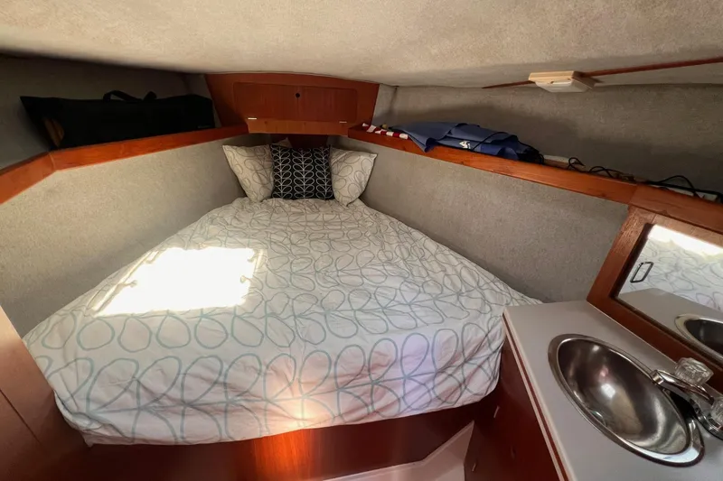 Slide: The Image of Cozy cabin interior of 1988 Hunter 37.5 sailboat with bed and sink. - 24