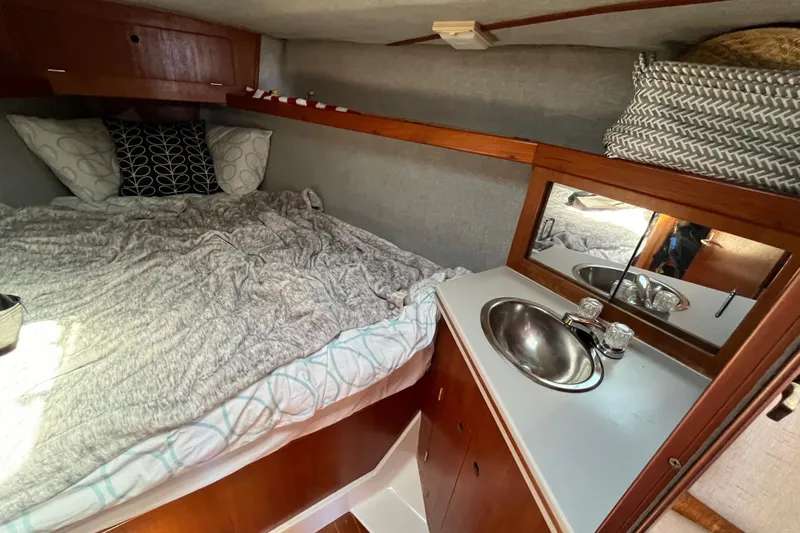 Slide: The Image of Cozy cabin interior of 1988 Hunter 37.5 sailboat with bed and sink. - 26
