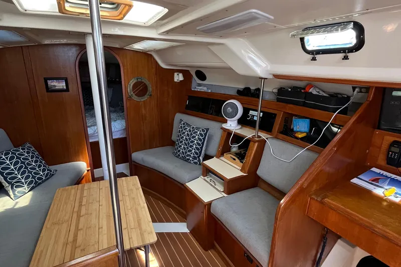Slide: The Image of Interior of 1988 Hunter 37.5 sailboat with cozy seating and wooden accents. - 28
