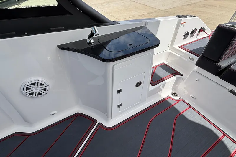Slide: The Image of 2026 Monterey Elite 27 OB boat interior with sleek sink and modern seating. - 10