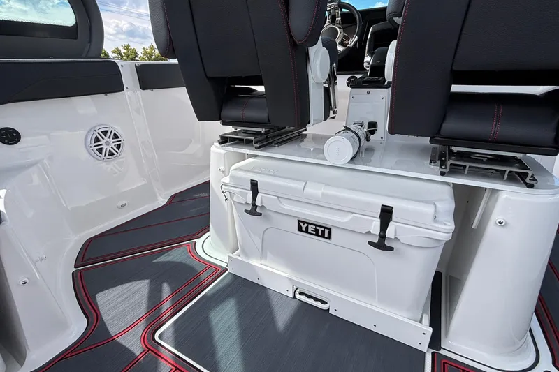 Slide: The Image of Interior of 2026 Monterey Elite 27 OB boat with Yeti cooler and stylish seating. - 13