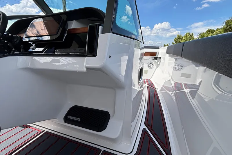 Slide: The Image of 2026 Monterey Elite 27 OB boat interior with sleek design and modern dashboard. - 14