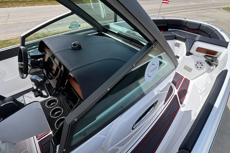 Slide: The Image of 2026 Monterey Elite 27 OB boat interior with sleek dashboard and seating area. - 15