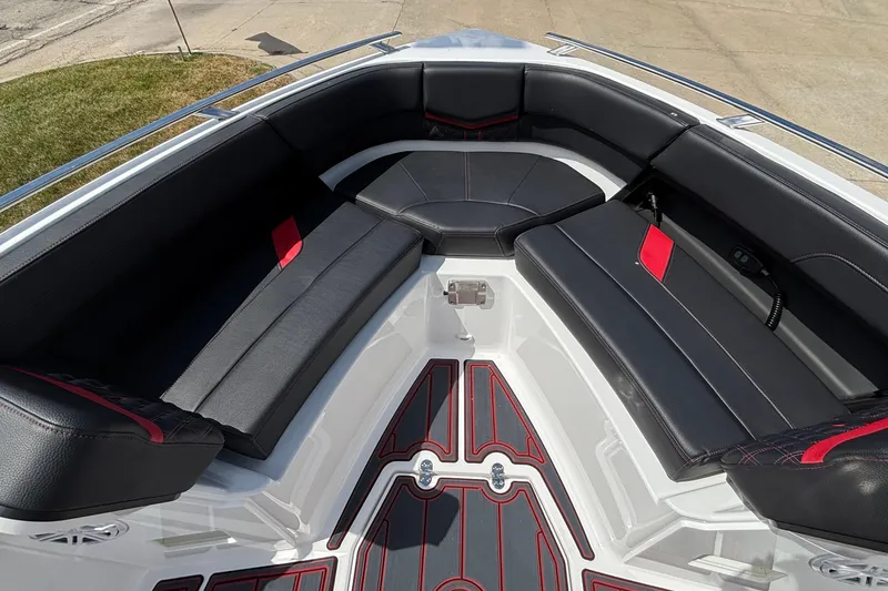 Slide: The Image of 2026 Monterey Elite 27 OB boat interior with black and red seating, modern design. - 17