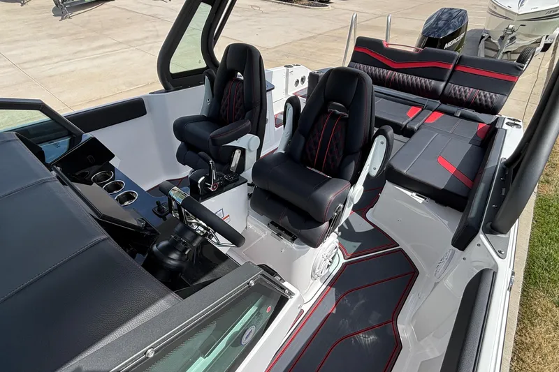 Slide: The Image of Interior of 2026 Monterey Elite 27 OB boat with modern seating and dashboard. - 20