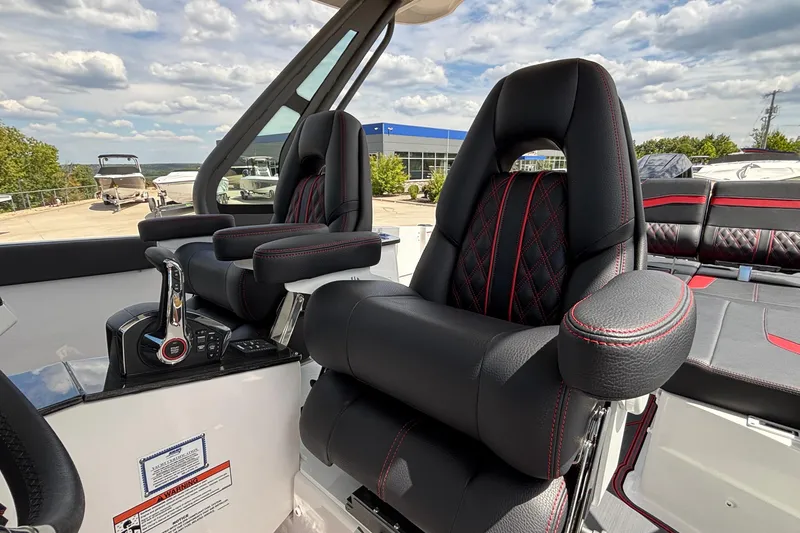 Slide: The Image of Luxurious interior of 2026 Monterey Elite 27 OB boat with plush seating and modern controls. - 21