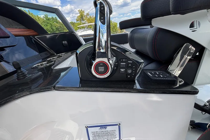 Slide: The Image of Control panel of 2026 Monterey Elite 27 OB boat with start-stop button and joystick. - 22