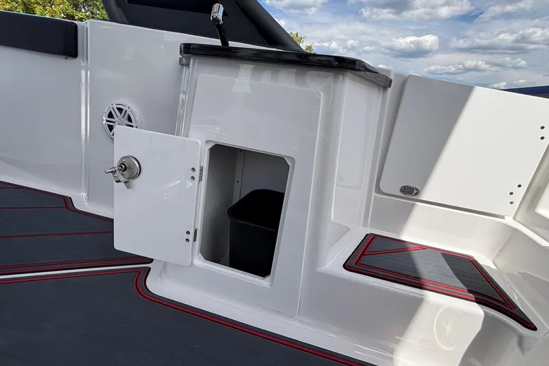 Slide: The Image of 2026 Monterey Elite 27 OB boat interior with storage compartment and sleek design. - 24