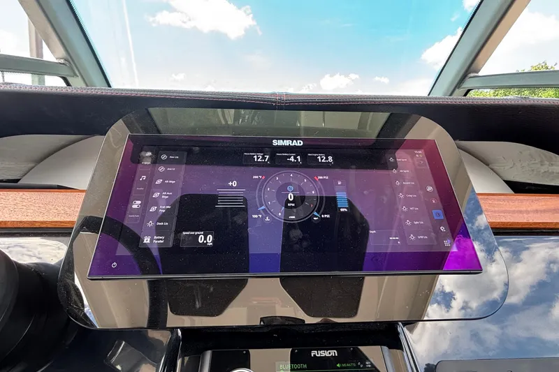 Slide: The Image of Dashboard of 2026 Monterey Elite 27 OB boat with Simrad navigation display. - 25