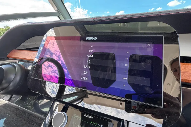 Slide: The Image of Dashboard of 2026 Monterey Elite 27 OB boat with Simrad display. - 26