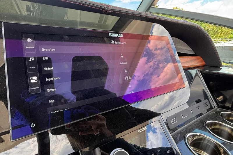 Slide: The Image of Dashboard of 2026 Monterey Elite 27 OB boat with Simrad display showing engine data. - 28