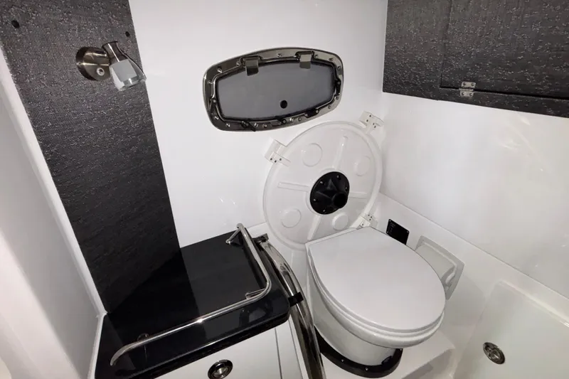 Slide: The Image of 2026 Monterey Elite 27 OB boat bathroom with modern fixtures and compact design. - 29