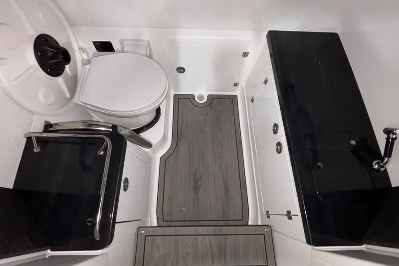 Slide: The Image of 2026 Monterey Elite 27 OB boat bathroom with modern fixtures and sleek design. - 32