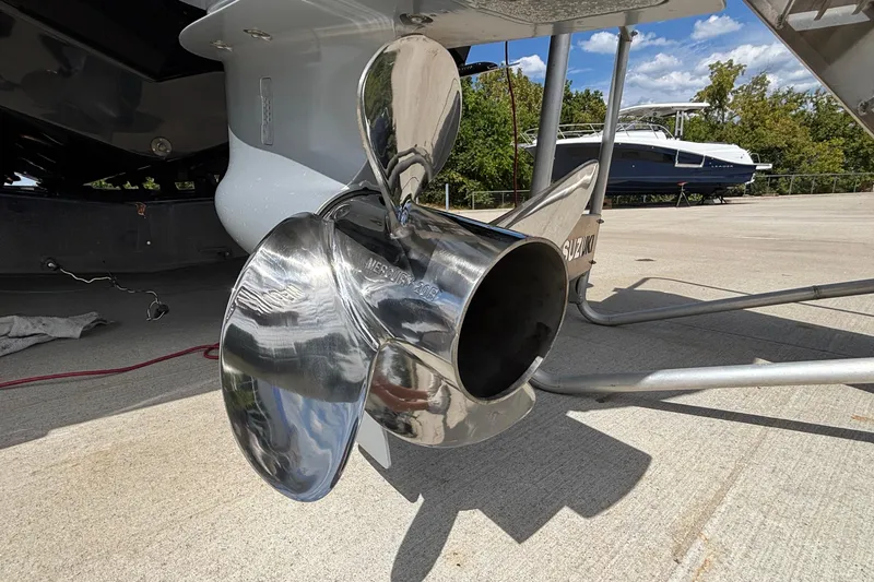 Slide: The Image of Close-up of a 2026 Monterey Elite 27 OB boat propeller on a sunny day. - 5