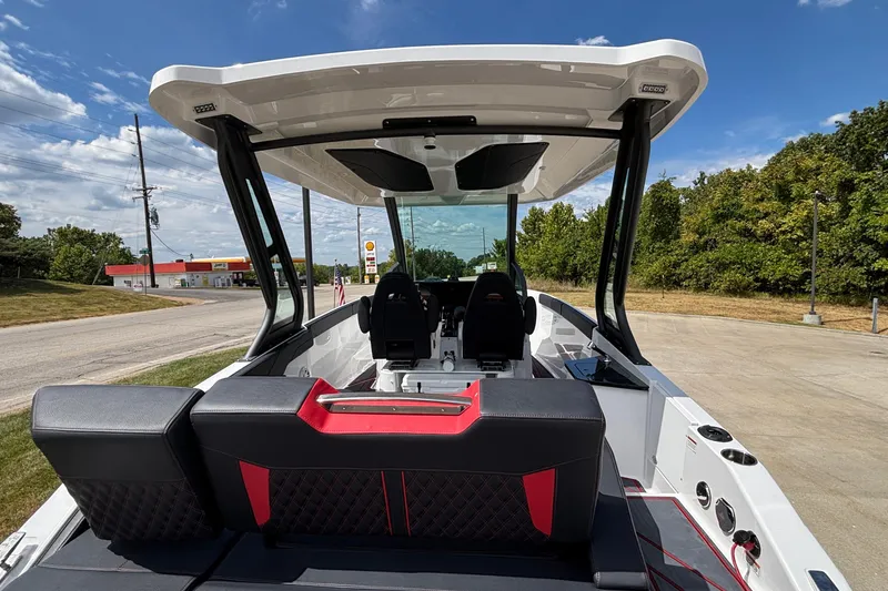 Slide: The Image of 2026 Monterey Elite 27 OB boat with sleek interior design and modern seating. - 6