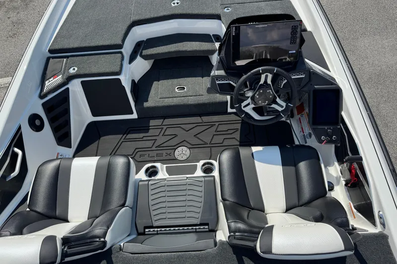 Slide: The Image of 2026 Skeeter FXR20 FLEX boat interior with dual seats and advanced dashboard controls. - 10
