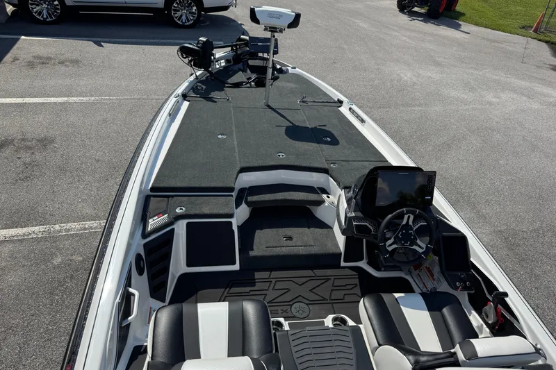 Slide: The Image of 2026 Skeeter FXR20 FLEX boat interior with advanced dashboard and seating. - 12