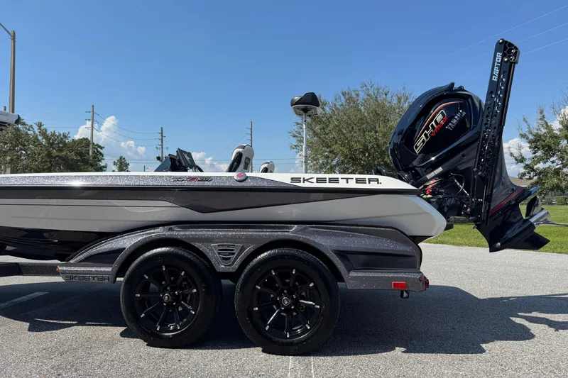 Slide: The Image of 2026 Skeeter FXR20 FLEX boat on trailer, featuring sleek design and powerful engine. - 19