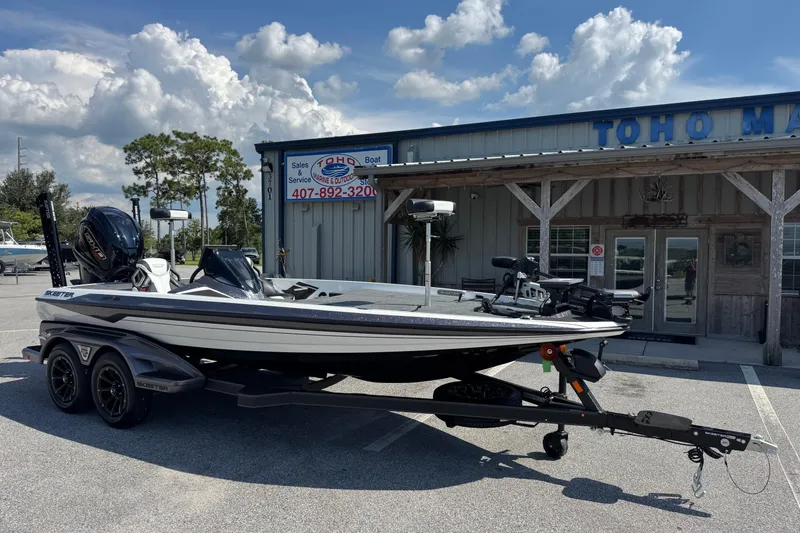 Slide: The Image of 2026 Skeeter FXR20 FLEX boat parked outside Toho Marine store. - 3