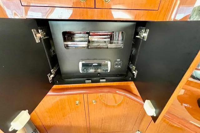 Slide: The Image of 2001 Sea Ray 420 Aft Cabin entertainment system with CD player and storage. - 22