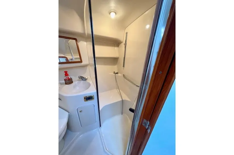 Slide: The Image of Bathroom interior of 2001 Sea Ray 420 Aft Cabin yacht, featuring sink and shower. - 35