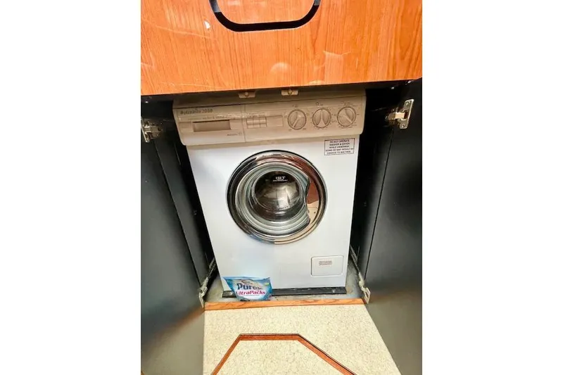 Slide: The Image of Washing machine inside 2001 Sea Ray 420 Aft Cabin yacht, wooden cabinetry. - 36