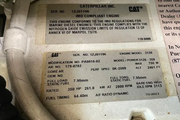 Slide: The Image of Caterpillar engine compliance label on 2001 Sea Ray 420 Aft Cabin, model 3126 specifications. - 52