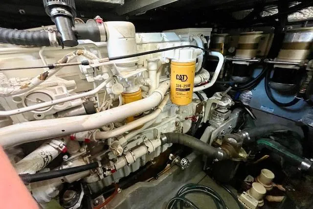 Slide: The Image of Engine room of a 2001 Sea Ray 420 Aft Cabin with CAT components visible. - 58