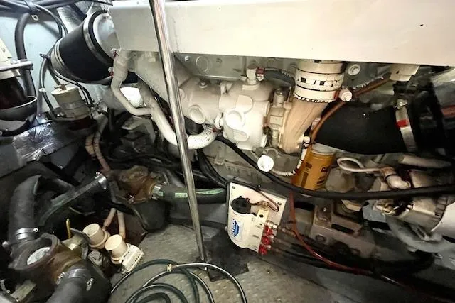 Slide: The Image of Engine room of a 2001 Sea Ray 420 Aft Cabin yacht, showcasing mechanical components. - 59