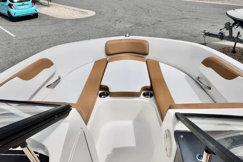 Slide: The Image of 2021 Bayliner VR5 Bowrider OB interior with tan and white seating. - 7