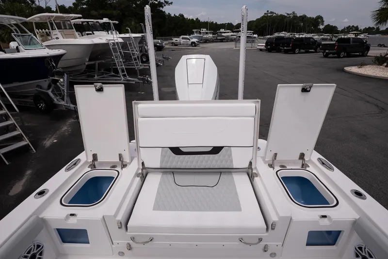 Slide: The Image of 2026 Blackfin 262 HB boat interior with open storage compartments and seating. - 16
