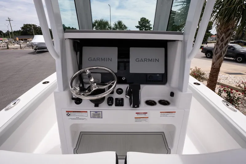 Slide: The Image of 2026 Blackfin 262 HB boat helm with Garmin displays and steering wheel. - 22