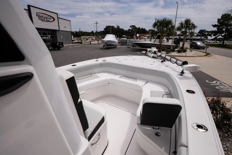 Slide: The Image of 2026 Blackfin 262 HB boat interior with seating, displayed at a dealership. - 28