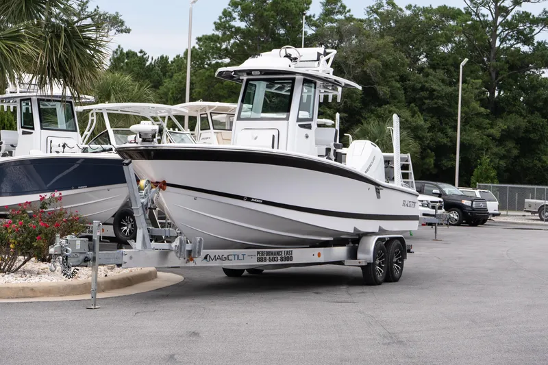 Slide: The Image of 2026 Blackfin 262 HB boat on trailer in outdoor dealership setting. - 3
