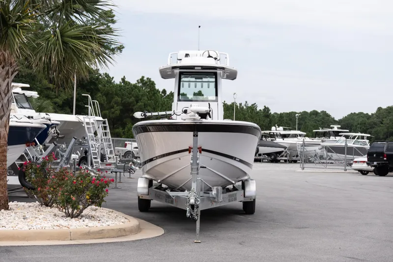 Slide: The Image of 2026 Blackfin 262 HB boat on trailer in marina parking lot. - 4
